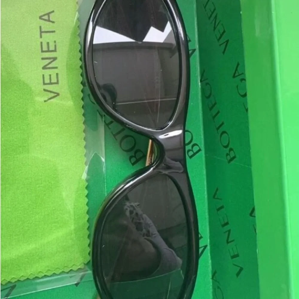 Bottega Veneta Black Frame Sunglasses with Amber Lenses and Gold Details